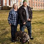 Patti and Angel posing outside together with their dog