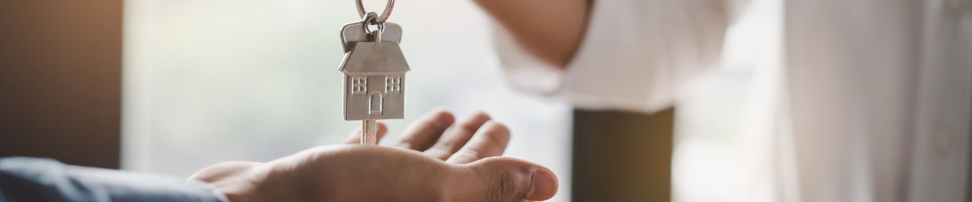 House key being placed in person's hand