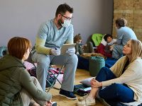 Healthcare workers talking with people