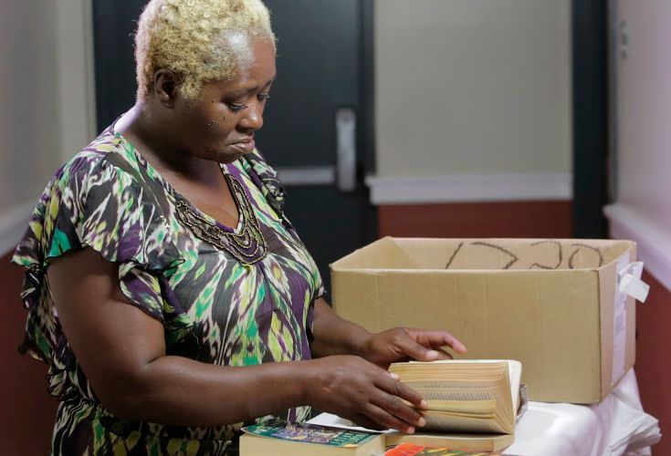 Woman looking through a donated book