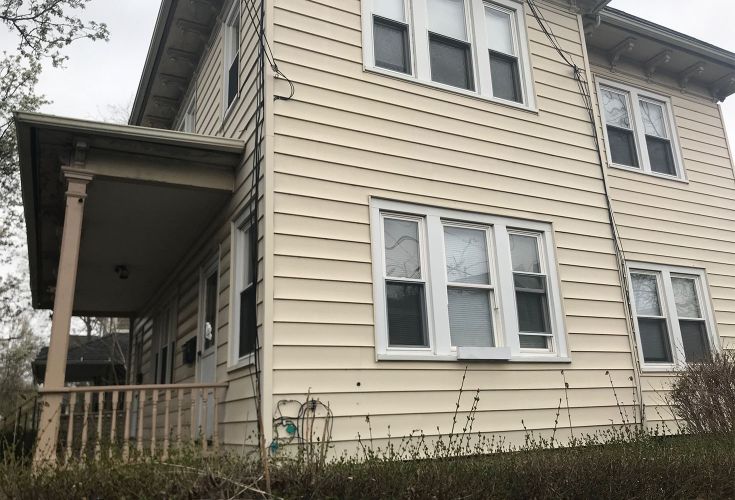 side-view of a pale yellow house