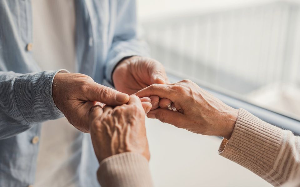 Man holding hands with a woman