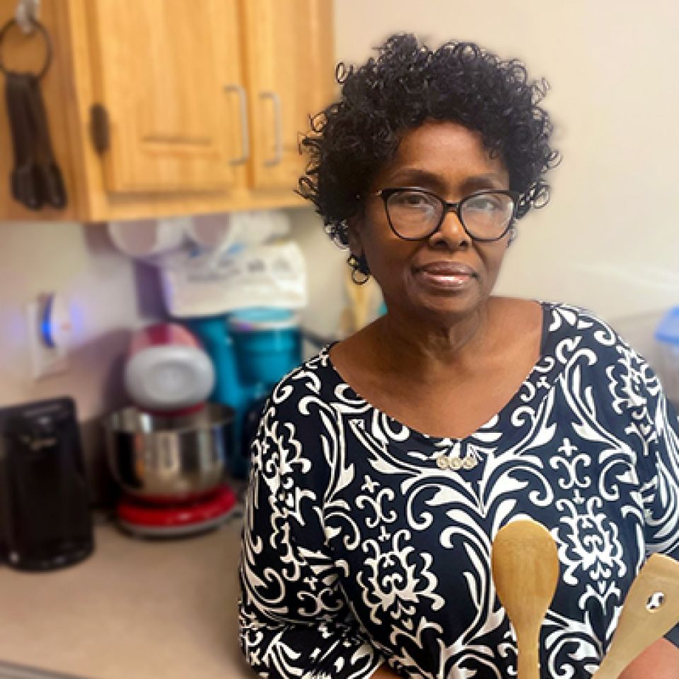 Bonzina posing in her kitchen